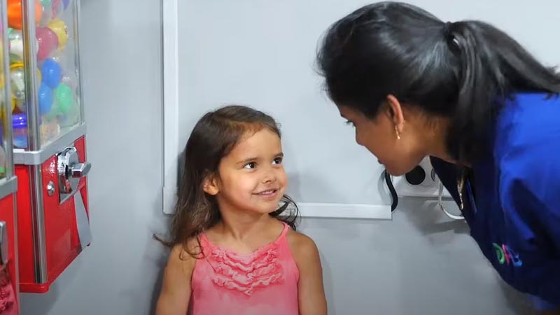 Dr. Joshi Talking with Happy Toddler Patient