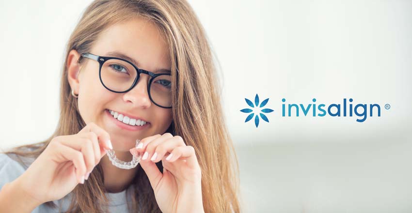 Adolescent Girl Holding an Invisalign Tray